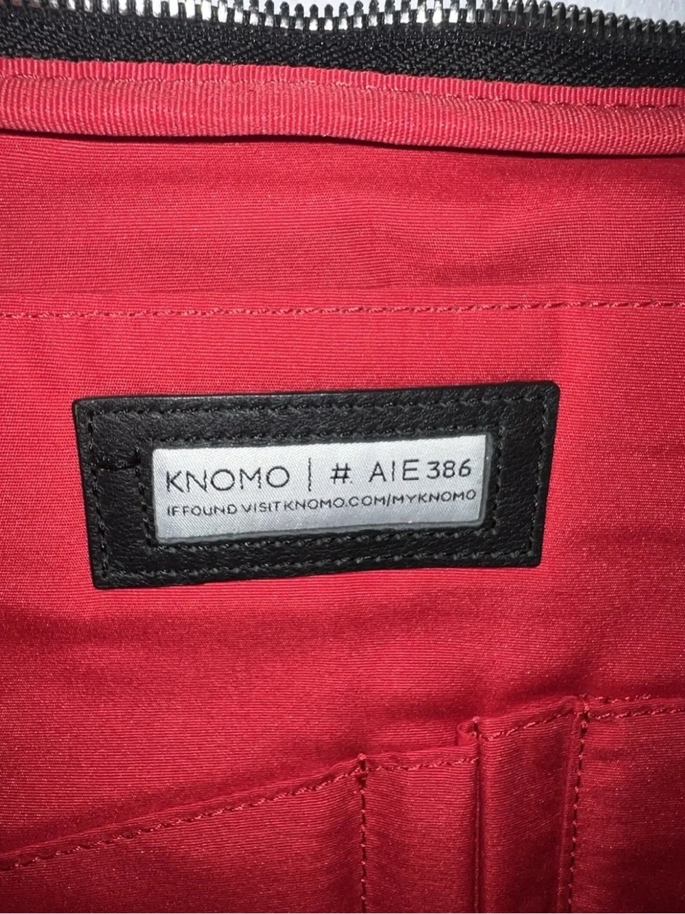Knomo Black Nylon Messenger Bag with Red Accents